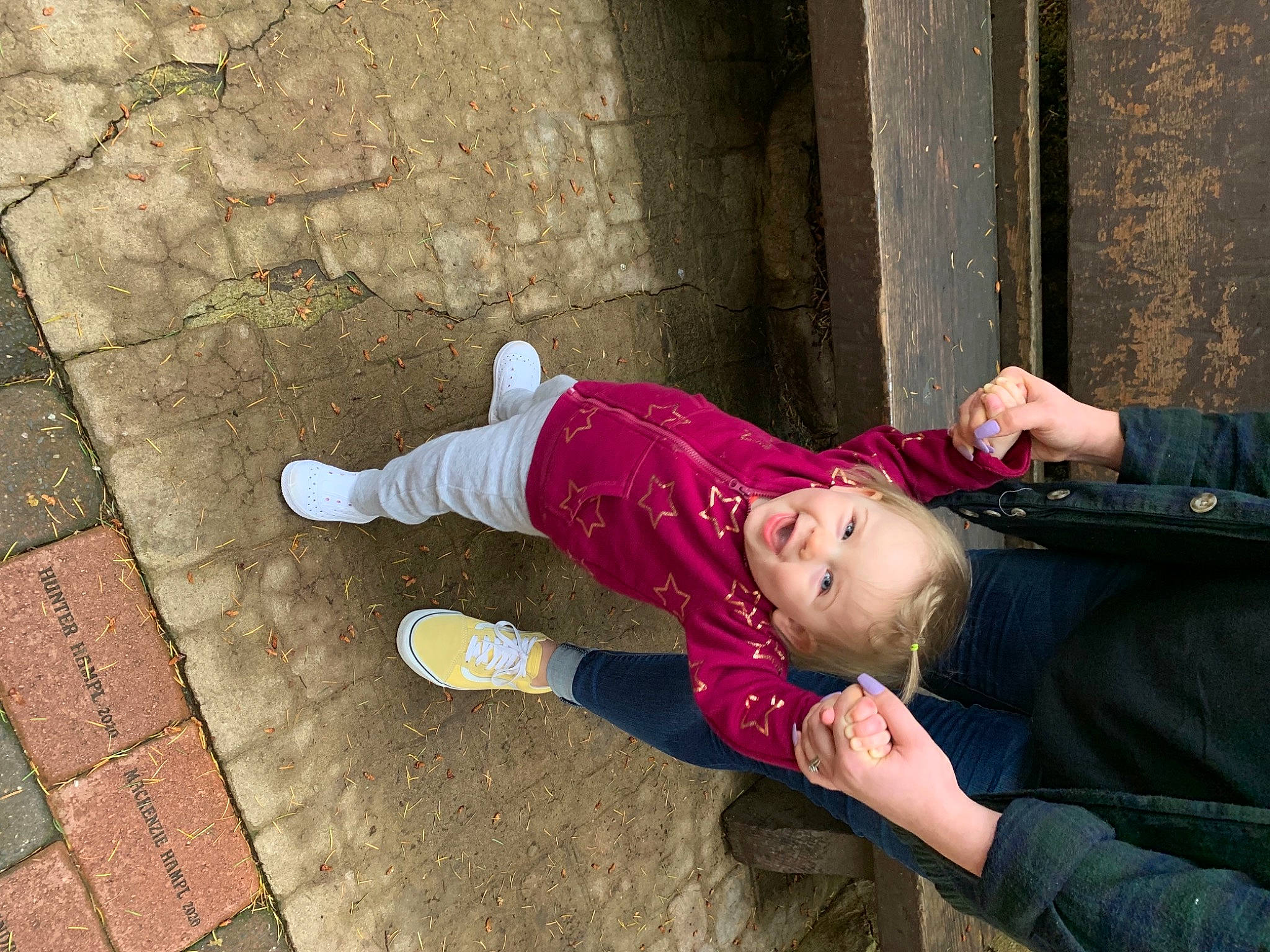 Lexie joined the competition — help win amazing prizes! clothing, cobblestone, concrete, eyewear, flooring, fun, grass, happy, human_leg, leisure, magenta, person, portrait_photography, shadow, sidewalk, sitting, street, tints_and_shades, toddler