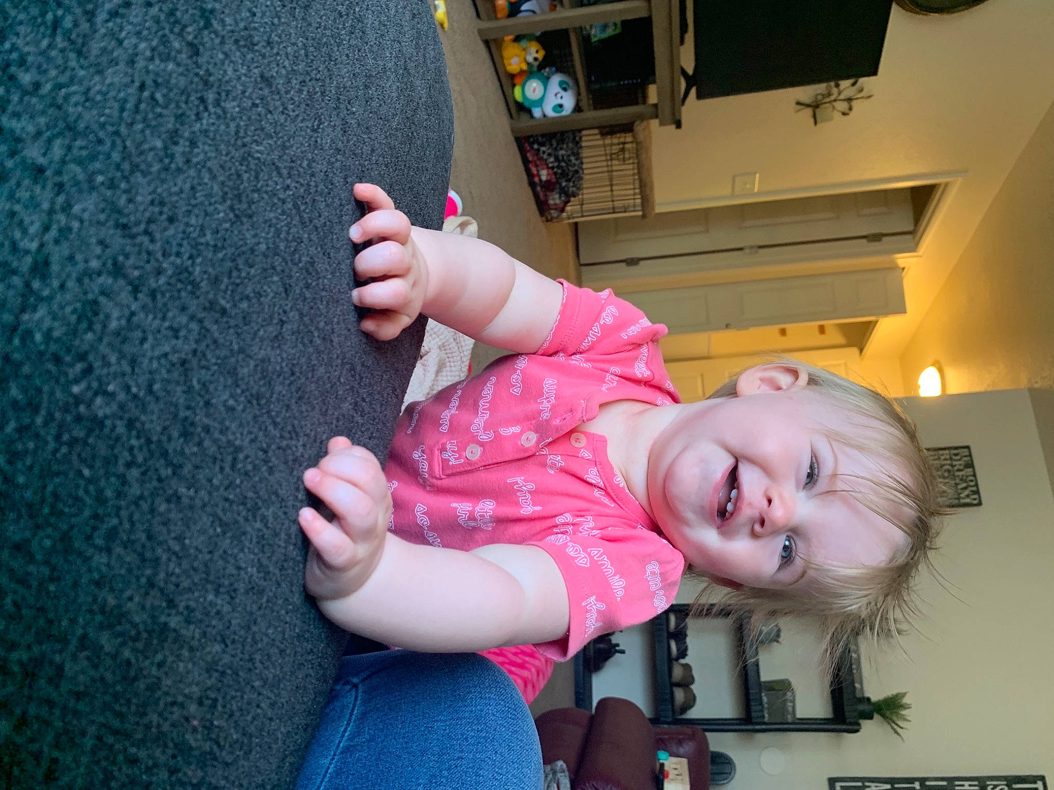 Lexie is registered to the contest to win money with this photo: chin, elbow, eye, finger, fun, gesture, happy, human_leg, joint, mouth, nail, nose, person, pink, shoulder, skin, smile, thigh, thumb, toddler