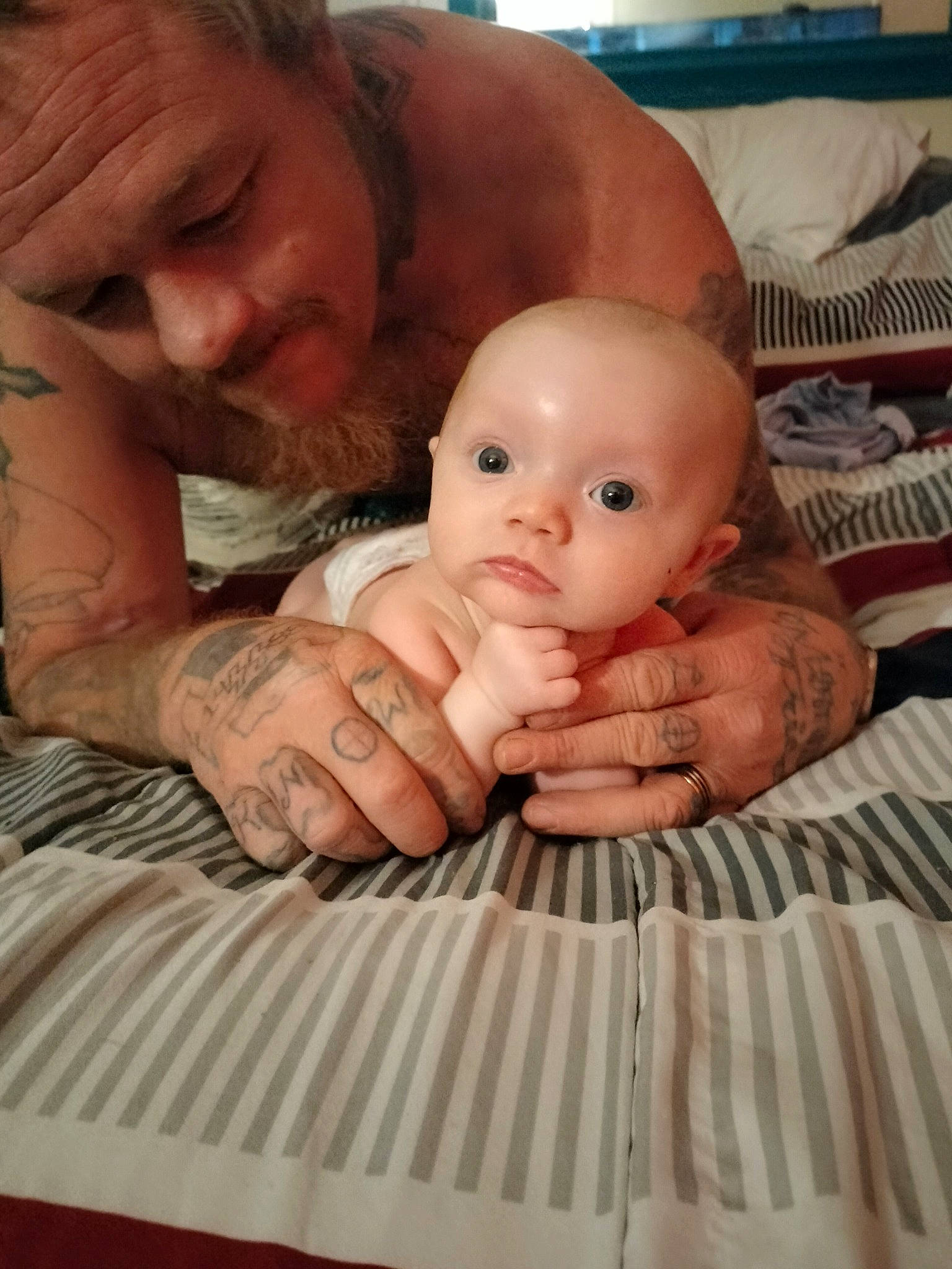 Kailani joined the competition — help win amazing prizes! abdomen, baby, chest, child, comfort, facial_expression, finger, fun, gesture, happy, linens, mouth, nail, nose, person, room, sitting, skin, thumb, toy