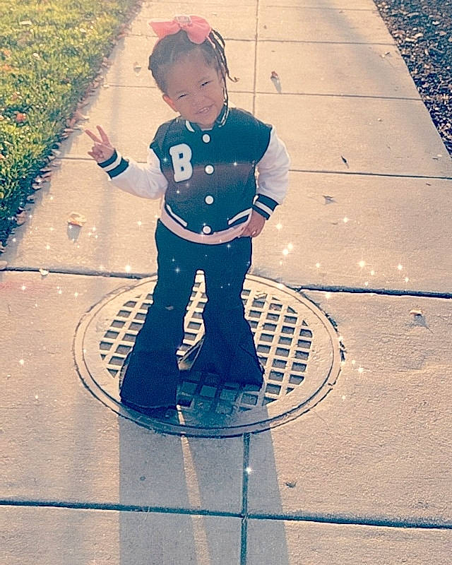 Paige joined the competition — help win amazing prizes! asphalt, blue, child, city, cool, electric_blue, fashion_accessory, happy, joy, pedestrian, people_in_nature, person, recreation, road, road_surface, shadow, sidewalk, smile, snapshot, standing