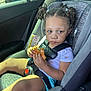 Amiyah joined the competition — help win amazing prizes! child, toddler, car_seat, car_interior, seatbelt, food, sandwich, curly_hair, pigtails, sunlight, window, clothing, shorts, shirt, safety, seat, hands, face, expression, vehicle