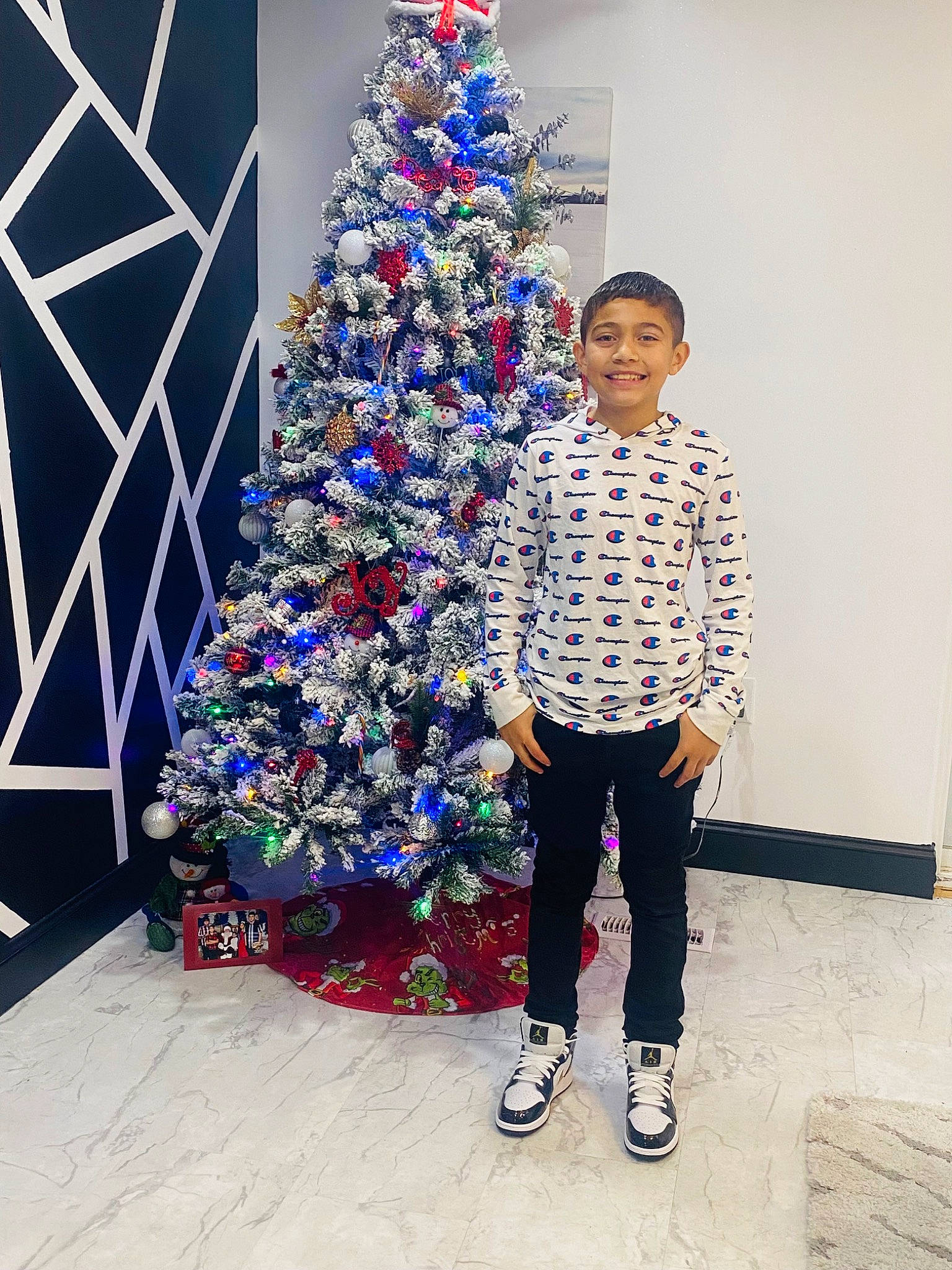 Nathan joined the competition — help win amazing prizes! christmas, christmas_decoration, christmas_ornament, christmas_tree, conifer, electric_blue, event, fun, happy, holiday, holiday_ornament, joy, leg, ornament, party_supply, person, plant, room, smile, standing