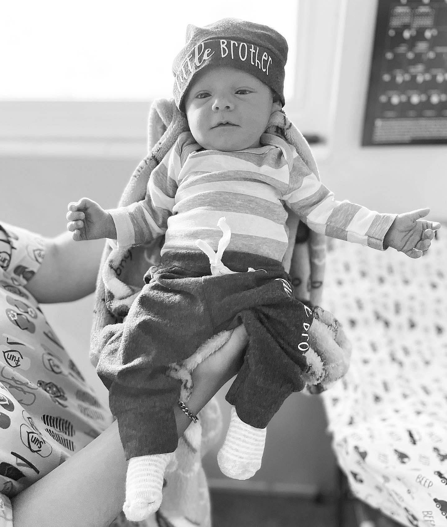 Charles Thomas Gebhardt joined the competition — help win amazing prizes! baby, baby_toddler_clothing, black, black_and_white, cap, child, comfort, gesture, happy, headwear, monochrome, monochrome_photography, people, person, photograph, sleeve, sock, standing, style, thigh