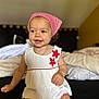 toddler, child, smiling, headscarf, red, white, dress, flower, bed, pillow, indoor, happy, cute, person, clothing, sitting, portrait, baby, young_child, skin