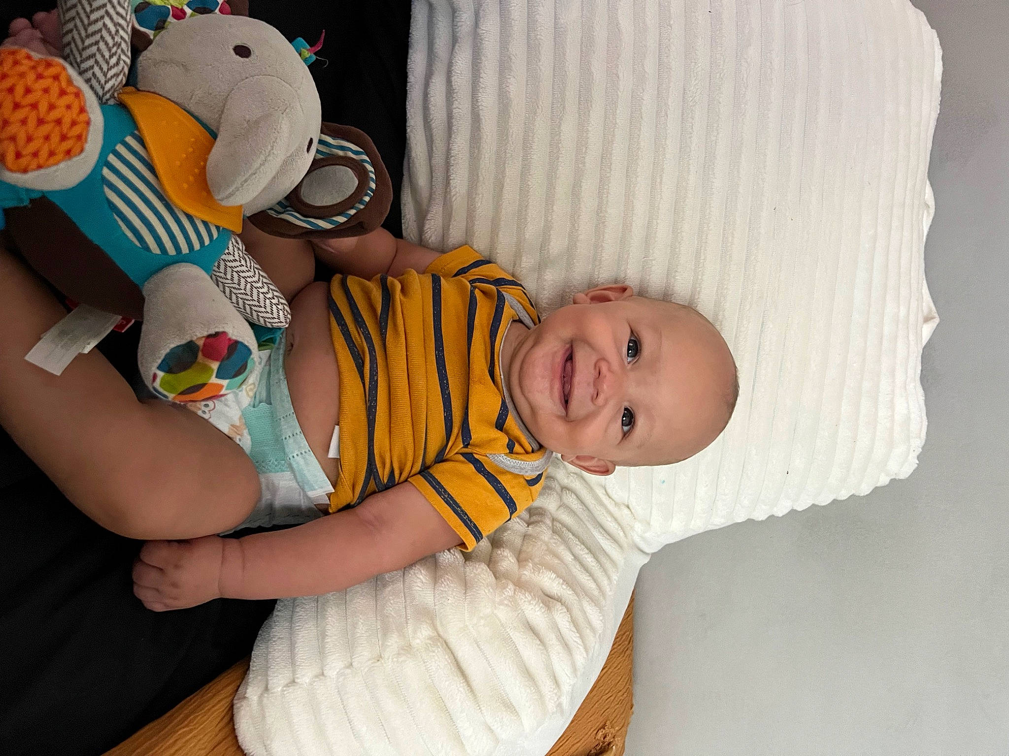 Kameron joined the competition — help win amazing prizes! arm, baby, baby_products, baby_sleeping, baby_toddler_clothing, child, comfort, finger, fun, hand, happy, joy, linens, pattern, person, sitting, sleeve, smile, t_shirt, toddler