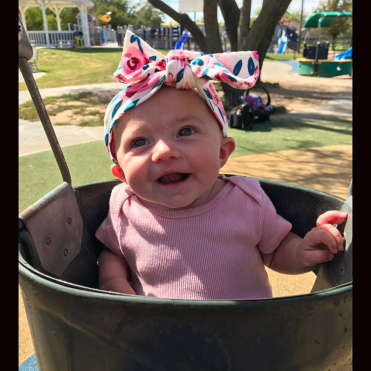 Emberly is registered to the contest to win money with this photo: baby, baby_products, child, cool, hair_accessory, headgear, headwear, person, pink, play, product, smile, toddler