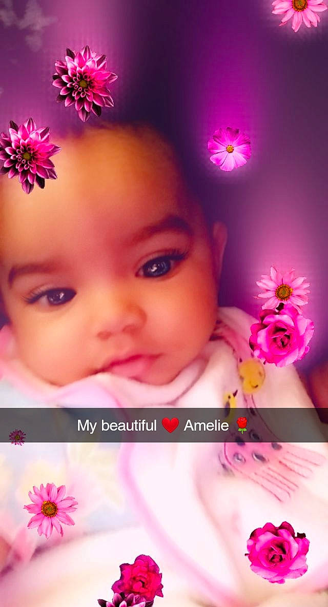 Amelia Rose is registered to the contest to win money with this photo: cheek, child, close_up, eyelash, flower, hair_accessory, head, magenta, nose, person, petal, photography, pink, plant, smile, toddler