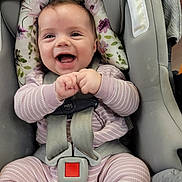 Oaklynn joined the competition — help win amazing prizes! baby, infant, car_seat, smile, happy, child, clothing, seatbelt, straps, sitting, pink, striped, face, hands, cushion, floral, indoors, person, cute, joyful