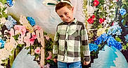 Petru participe au concours pour gagner de l'argent avec cette photo : child, boy, bunny_ears, plaid_shirt, jeans, sneakers, pose, smile, spring, easter, eggs, flowers, backdrop, colorful, green_grass, playful, cute, holiday, festive, portrait