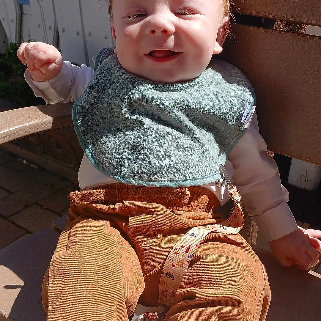 Spencer Reid joined the competition — help win amazing prizes! baby, bodypart, clothing, face, finger, footwear, hand, head, hosiery, jeans, knitwear, pants, person, photography, portrait, shoe, sitting, sock, sweater, wood