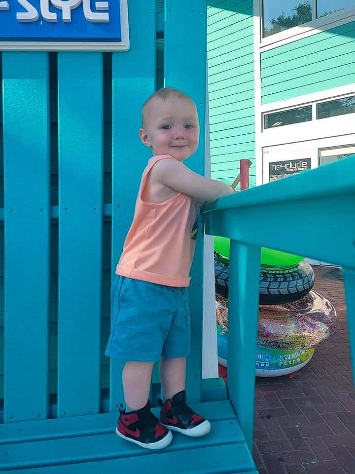 Greyson is registered to the contest to win money with this photo: aqua, azure, baby_toddler_clothing, beauty, blue, child, door, electric_blue, green, joy, leisure, line, magenta, person, pink, product, shoe, shorts, sleeve, smile