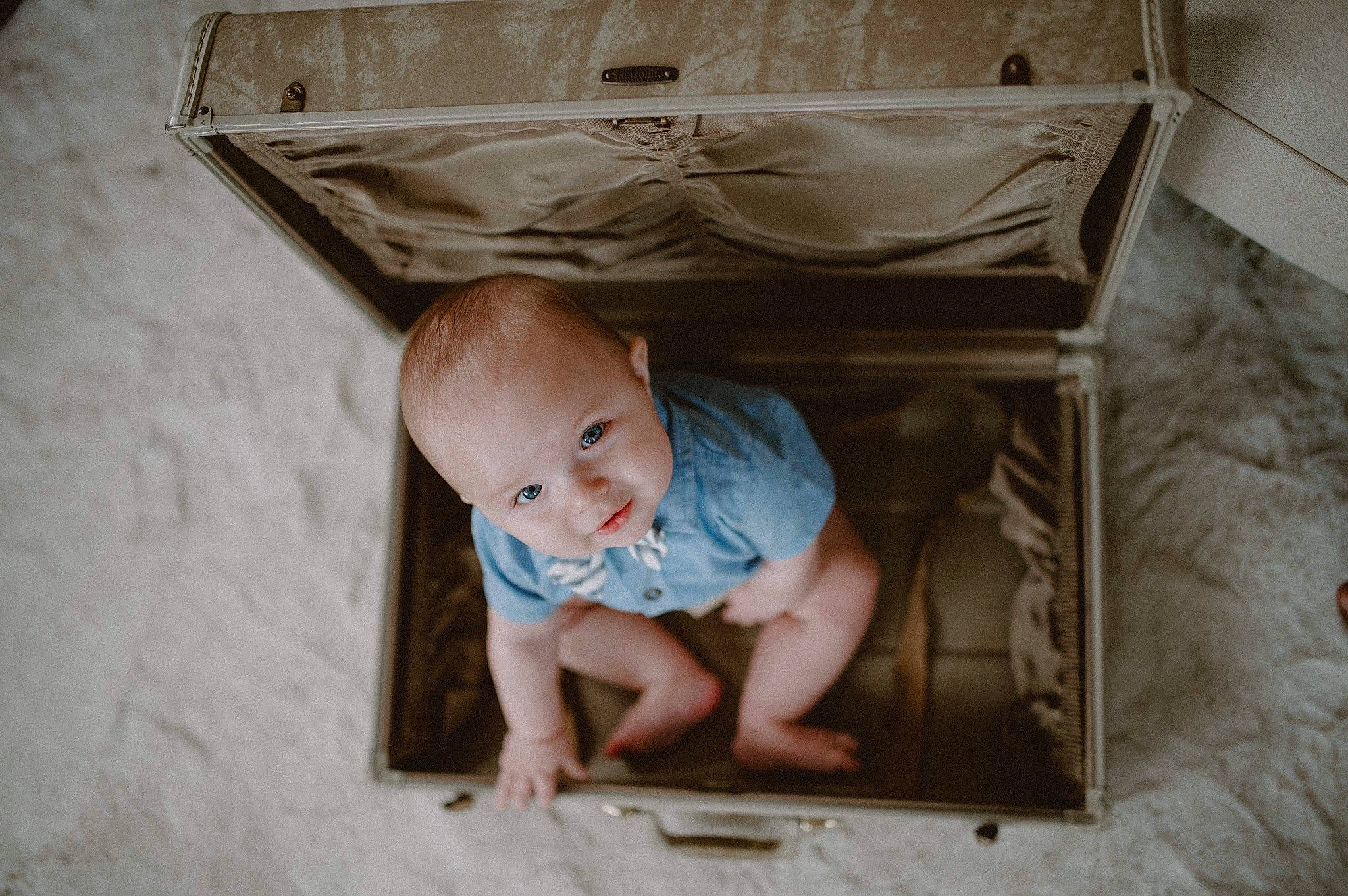 William is registered to the contest to win money with this photo: baby, baby_products, baby_toddler_clothing, child, comfort, cradle, floor, flooring, foot, hardwood, head, illustration, infant_bed, linens, person, product, room, sitting, t_shirt, toddler