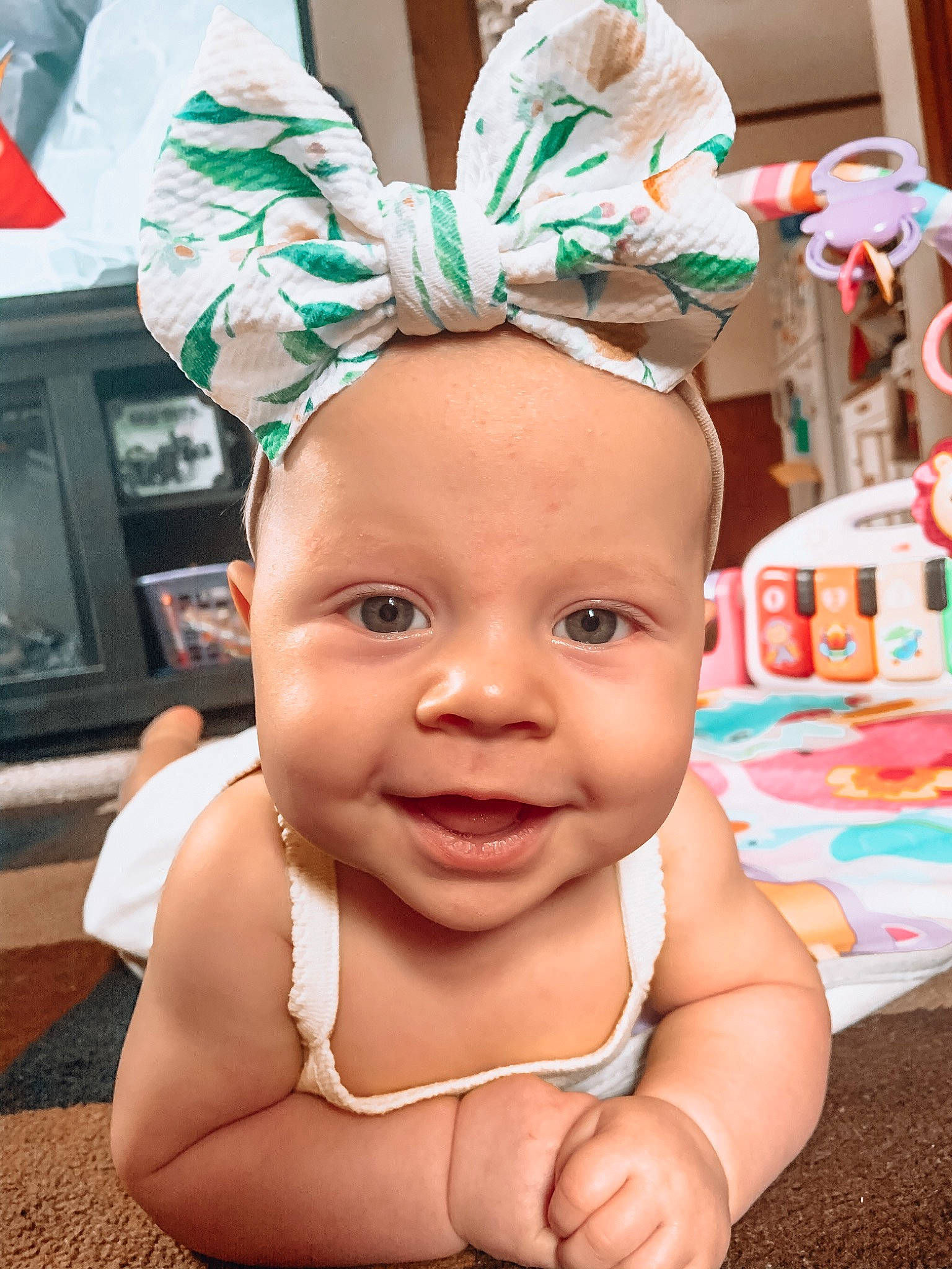 Isla is registered to the contest to win money with this photo: baby, child, ear, face, fashion_accessory, hair_accessory, head, headgear, headwear, person, skin, smile, toddler