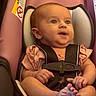 Anora joined the competition — help win amazing prizes! baby, infant, car_seat, child, seatbelt, pink, clothing, cute, expression, hands, feet, sitting, straps, safety, portrait, indoors, person, head, skin, young
