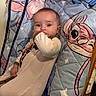 Anora joined the competition — help win amazing prizes! baby, child, infant, onesie, quilt, cartoon, animal_print, thumb_sucking, cute, indoor, bed, pajamas, sleepwear, face, person, young_child, comfort, expression, lying_down, soft_toy