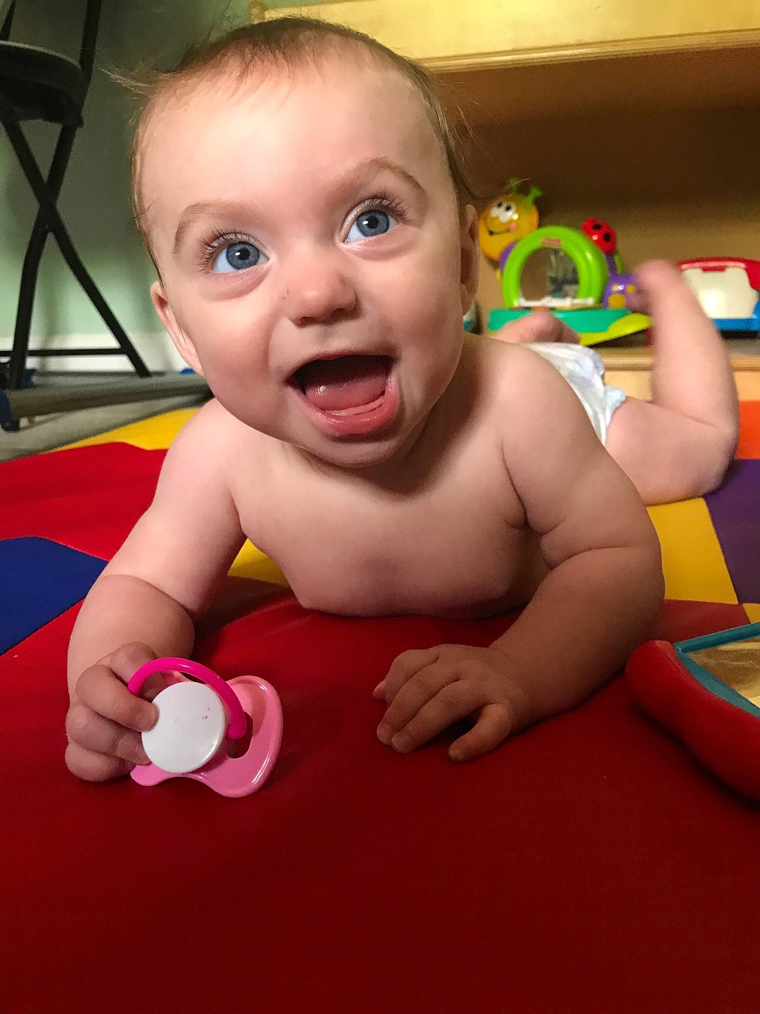 Isabella joined the competition — help win amazing prizes! baby, baby_playing_with_toys, baby_products, baby_toys, cheek, child, fun, head, person, play, product, skin, smile, toddler, toy, tummy_time