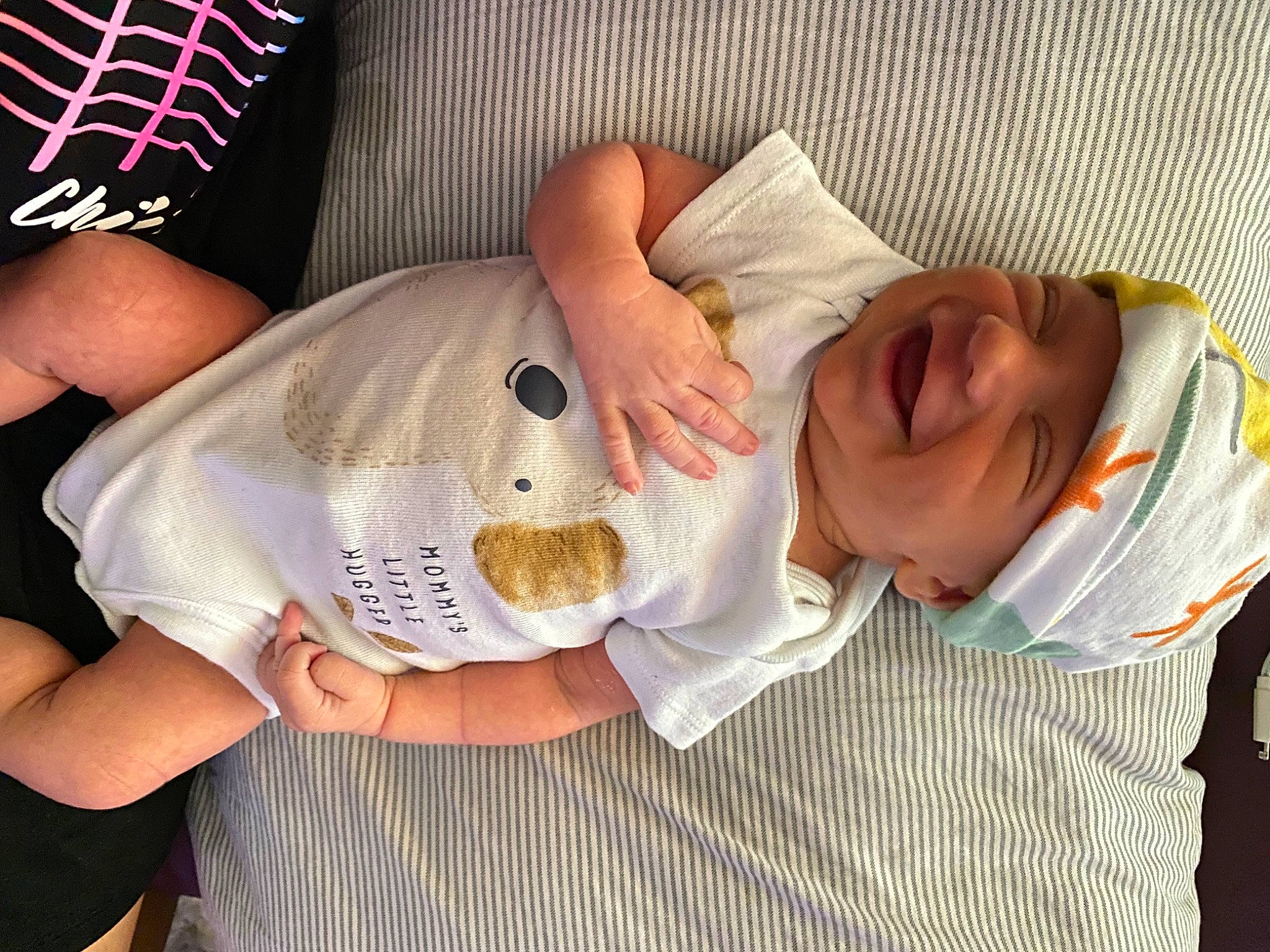 Evan is registered to the contest to win money with this photo: baby, baby_toddler_clothing, child, comfort, elbow, flesh, gesture, headwear, nail, pattern, person, sleeve, thumb, wrist