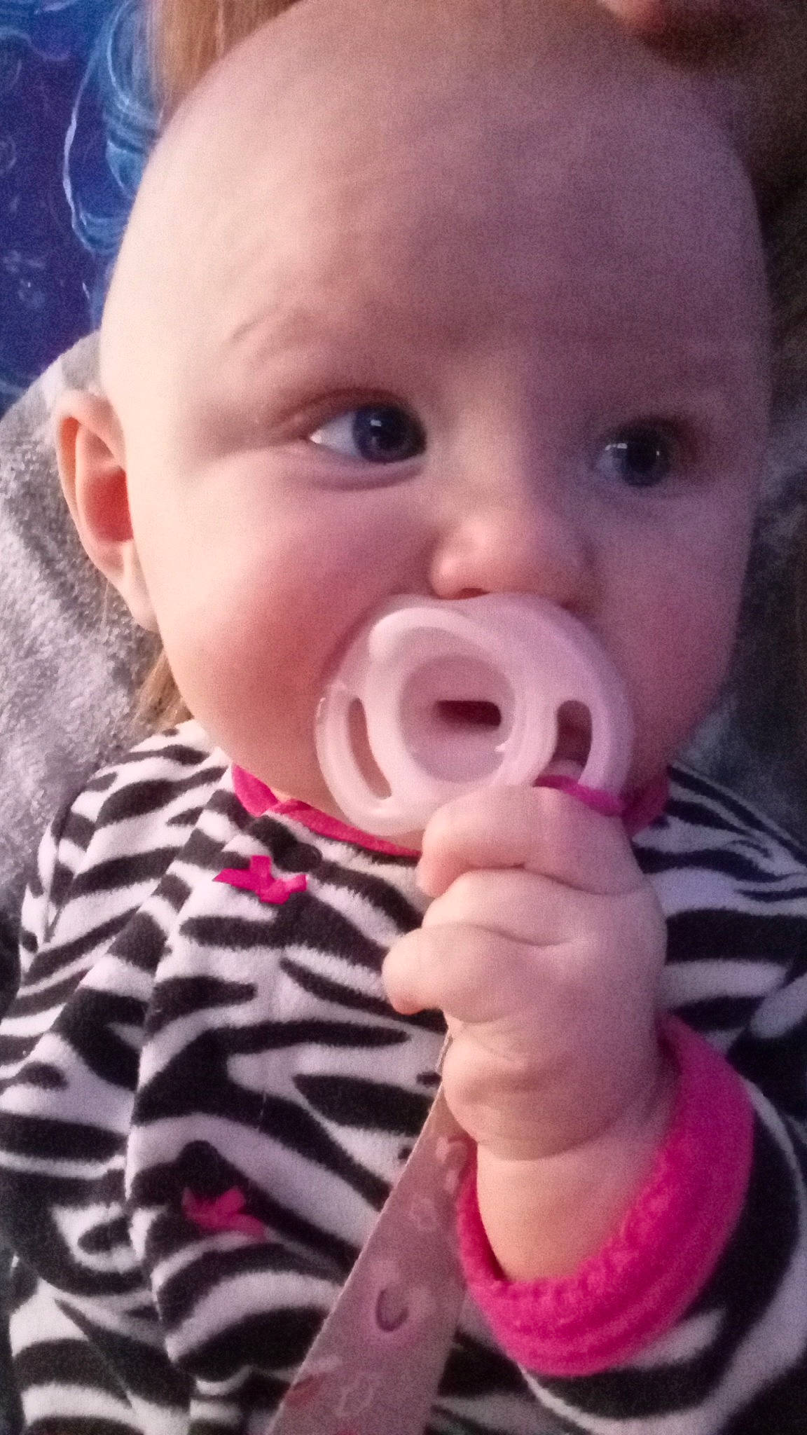 Brynlee is registered to the contest to win money with this photo: baby, baby_toddler_clothing, cheek, child, close_up, ear, eyelash, finger, fun, gesture, happy, human_body, lip, nail, nose, person, pink, skin, sleeve, thumb