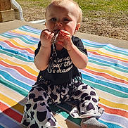 Patsy joined the competition — help win amazing prizes! baby, infant, child, toddler, sitting, striped_blanket, keys, keychain, chewing, socks, patterned_pants, porch, sunlight, outdoor, grass, trees, building, smile, face, shadow