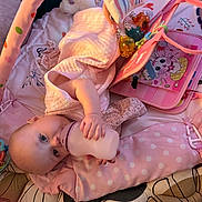 Patsy is registered to the contest to win money with this photo: baby, bottle, toy, play_mat, blanket, infant, pink, child, cute, lying_down, soft_toys, feeding, indoor, comfort, sleepwear, head, hand, face, childcare, relaxing