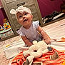 Patsy joined the competition — help win amazing prizes! baby, blanket, bow, carpet, child, clothing, curious, cute, dresser, floor, furniture, headband, indoor, person, plush_toy, room, sitting, smile, toy, wood
