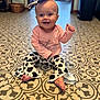 Patsy joined the competition — help win amazing prizes! baby, bow, child, clothing, cow_print, cute, eyes, floor, happy, headband, indoor, infant, long_sleeve, pants, patterned_floor, person, pink_shirt, sitting, smiling, toes