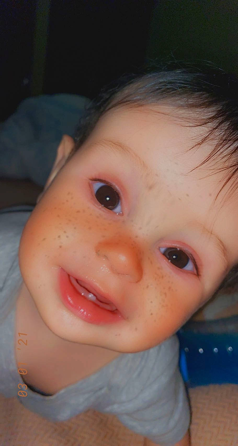 Marcus is registered to the contest to win money with this photo: baby, baby_toddler_clothing, cheek, chin, close_up, ear, eyelash, forehead, fun, happy, iris, jaw, lip, mouth, neck, no_expression, nose, person, skin, smile