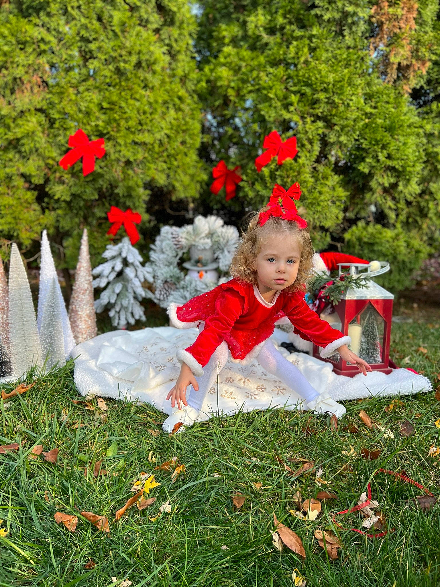 Aleksandra is registered to the contest to win money with this photo: baby_toddler_clothing, botany, dress, event, flower, garden, grass, happy, hat, holiday, lawn, leaf, people_in_nature, person, petal, plant, shrub, toddler, tree, vertebrate