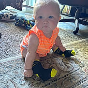 Ventus joined the competition — help win amazing prizes! baby, child, infant, carpet, socks, batman, orange_clothing, indoor, furniture, chair, pillow, floor, curious, hair, cute, small_hands, patterned_rug, home, sitting, portrait
