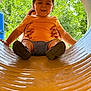toddler, child, playground, slide, yellow_slide, orange_shirt, smiling, outdoor, trees, greenery, hands, adult, fun, play, summer, happy, person, park, casual_clothing, daytime