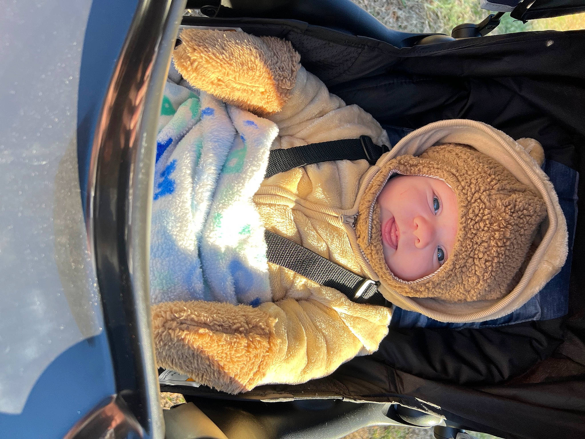 Jonah joined the competition — help win amazing prizes! auto_part, automotive_exterior, automotive_lighting, baby, baby_carriage, baby_products, baby_toddler_clothing, car_seat, cheek, child, comfort, electric_blue, head, headgear, headwear, hood, mouth, person, toddler, tree