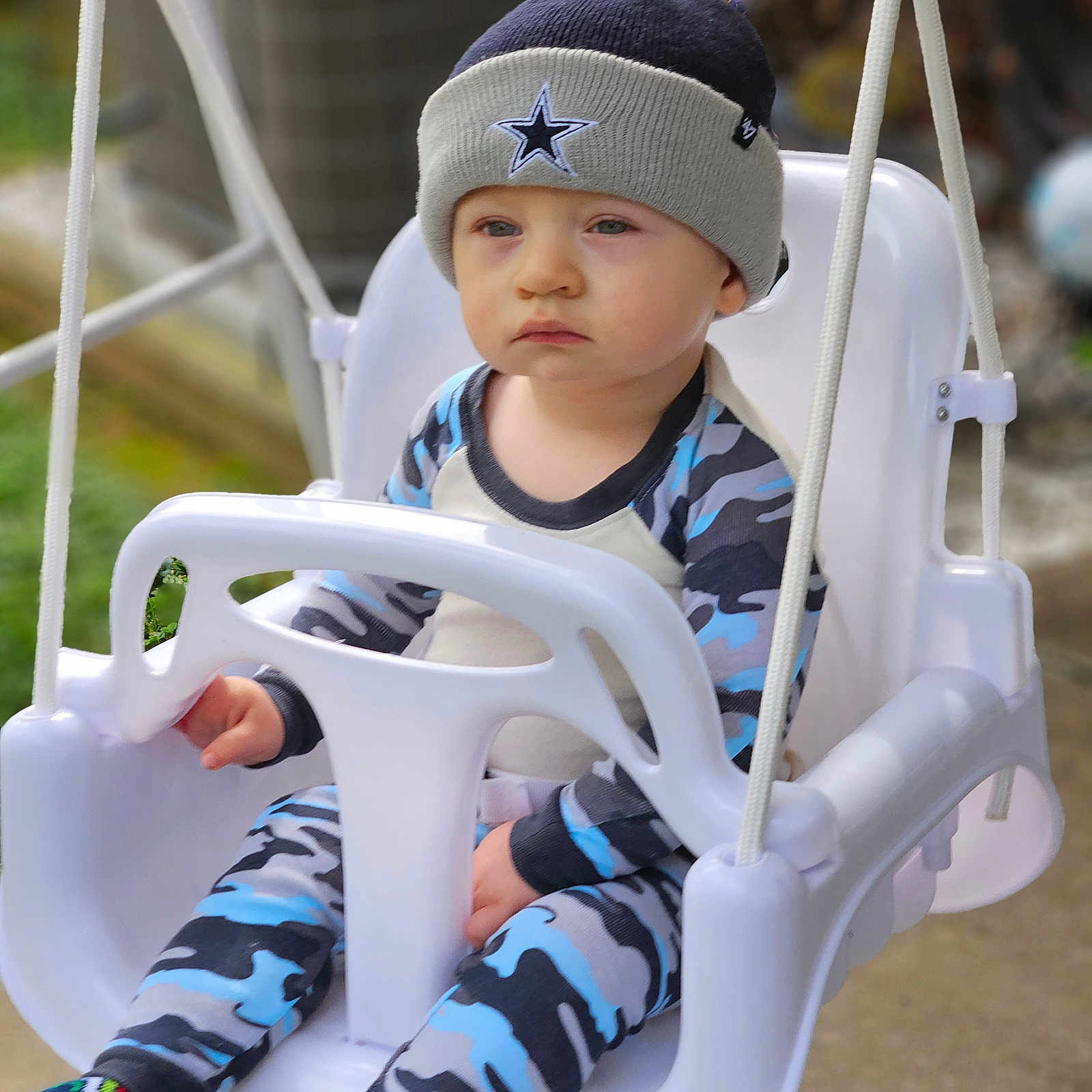 Joseph is registered to the contest to win money with this photo: baby, beanie, cap, clothing, face, footwear, hat, head, hosiery, outdoorplayarea, outdoors, person, photography, playarea, portrait, shoe, sitting, sock, swing, toy