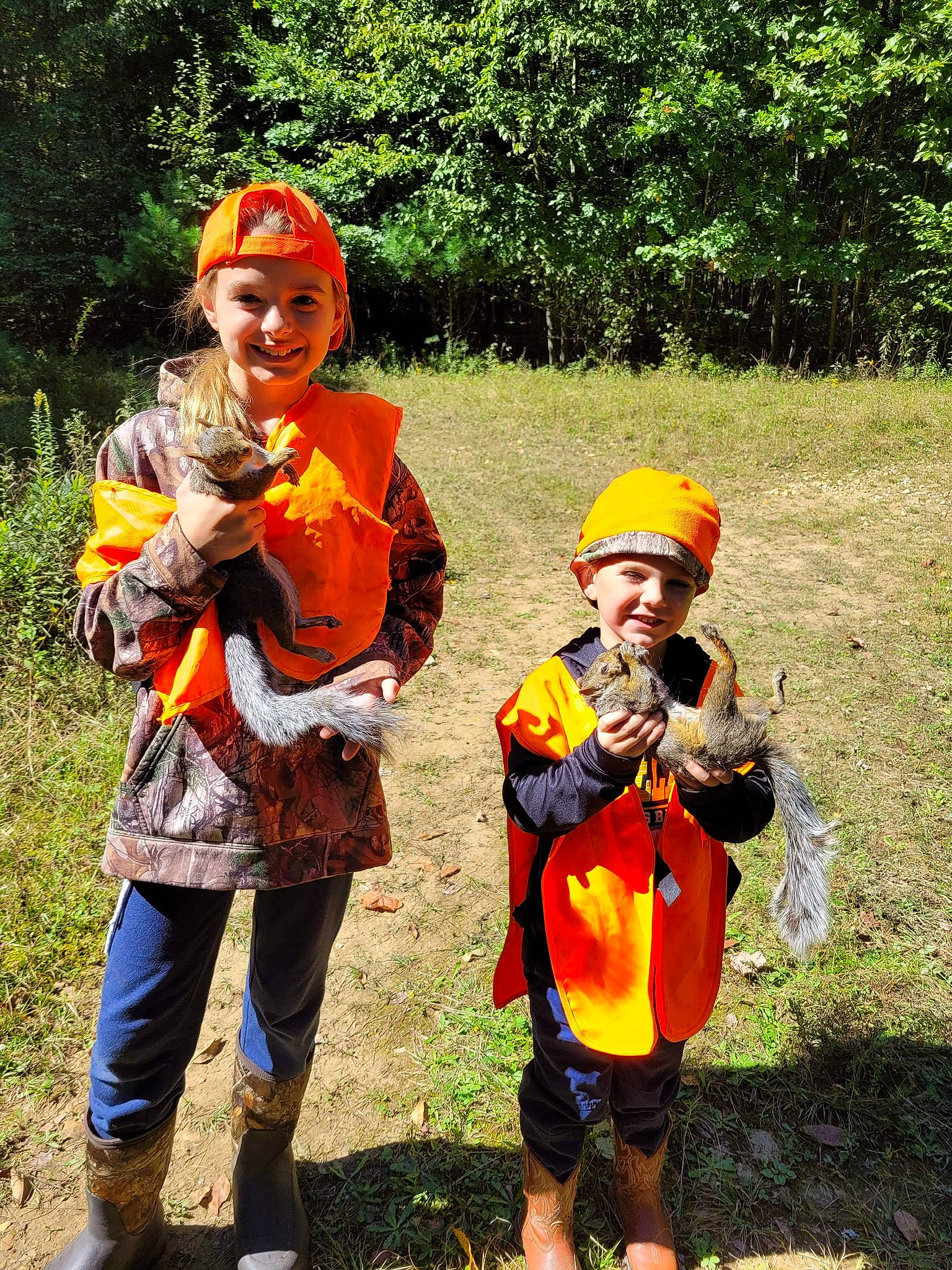 Triston is registered to the contest to win money with this photo: cucurbita, event, fruit, fun, grass, hat, headwear, joy, leisure, musical_instrument, orange, people_in_nature, person, personal_protective_equipment, plant, pumpkin, recreation, shorts, smile, toddler