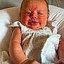Karsyn is registered to the contest to win money with this photo: baby, infant, face, tongue, blanket, pillow, skin, arm, clothing, smile, cute, child, person, indoors, expression, newborn, resting, soft, young, closeup
