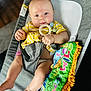 Karsyn joined the competition — help win amazing prizes! baby, baby_seat, blue_eyes, candid, child, chubby_cheeks, colorful_book, comfort, cute, diaper, foot, gray_fabric, hand, indoor, infant, relaxed, soft_focus, striped_clothing, teething_ring, toy
