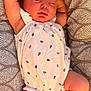 Karsyn joined the competition — help win amazing prizes! baby, sleeping, infant, cushion, patterned, white_outfit, ladybug_print, arms_up, legs_bent, peaceful, soft_light, indoor, cute, skin_texture, comfort, resting, child, newborn, portrait, cozy