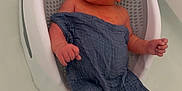 Karsyn joined the competition — help win amazing prizes! baby, infant, bath, bathtub, water, bath_seat, blue_cloth, relaxing, floating, newborn, skin, face, hand, foot, support, white, gray, indoors, clean, cute
