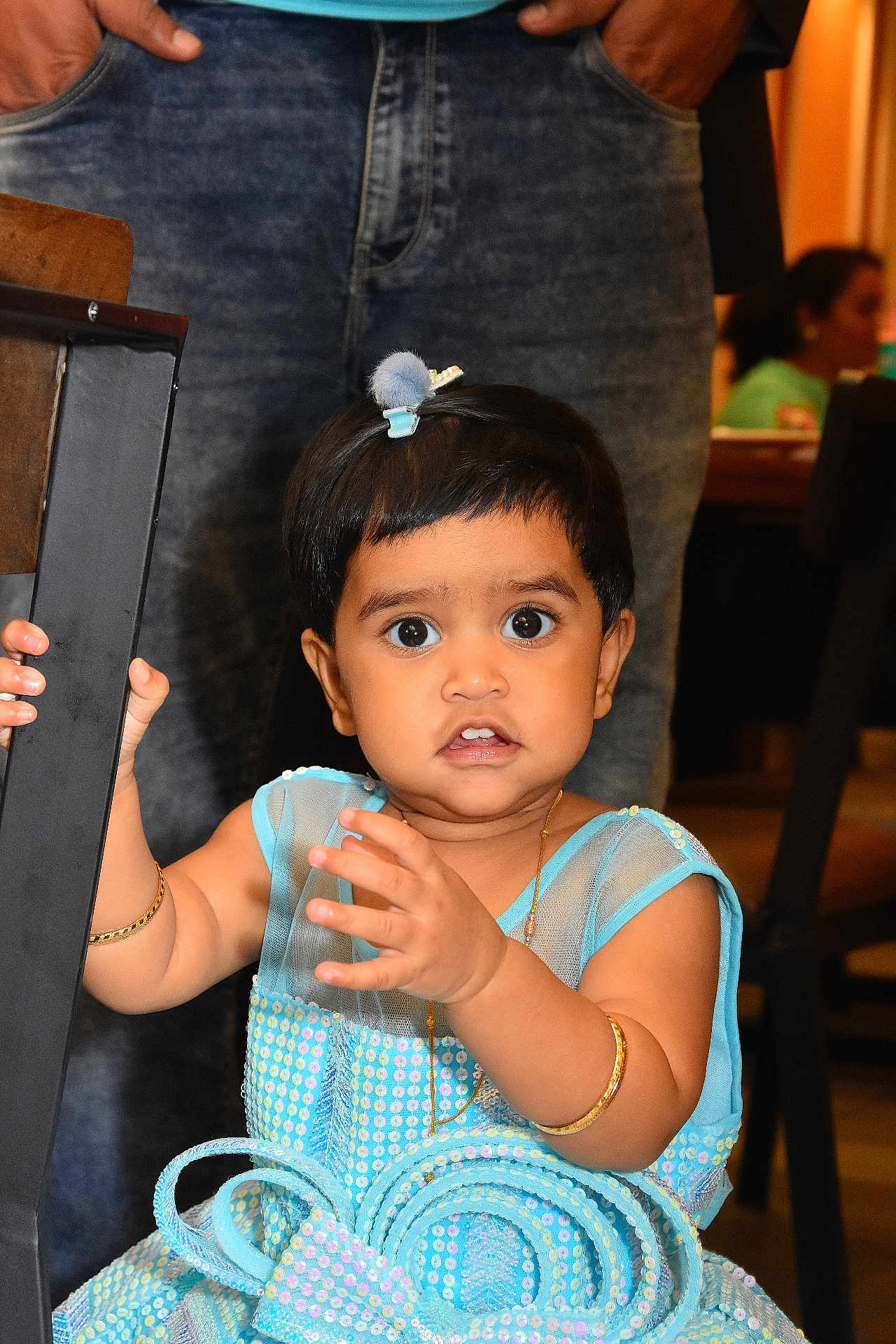Roxy Roselle participe au concours pour gagner de l'argent avec cette photo : toddler, child, blue_dress, jewelry, bracelet, hair_clip, indoor, person, curious, wide_eyes, chair, adult, standing, hand, expression, portrait, cute, baby, people, family