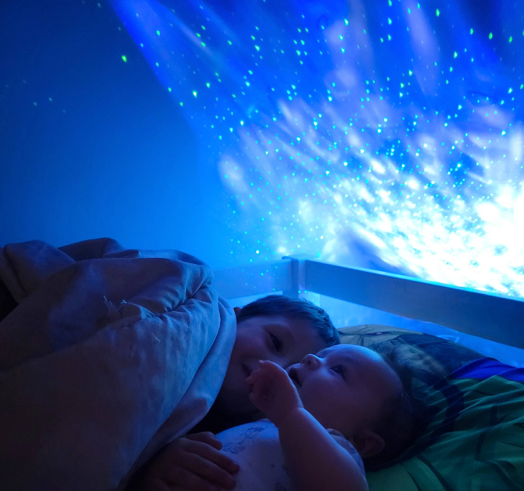 Asa is registered to the contest to win money with this photo: astronomical_object, atmosphere, aurora, azure, baby, blue, cloud, comfort, darkness, electric_blue, event, flash_photography, lighting, person, purple, science, sky, space, star, toddler