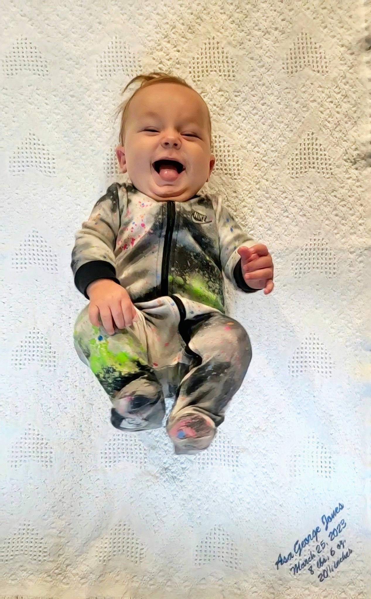 Asa joined the competition — help win amazing prizes! arm, baby, baby_toddler_clothing, comfort, face, finger, flooring, gesture, happy, knee, outerwear, pattern, person, skin, sleeve, smile, t_shirt, textile, thumb, toddler