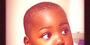 Khimerie is registered to the contest to win money with this photo: casual_clothing, child, closeup, curious, cute, expression, face, hands, human, indoors, looking_away, person, portrait, resting, short_hair, skin, soft_light, toddler, warm_tone, young_child