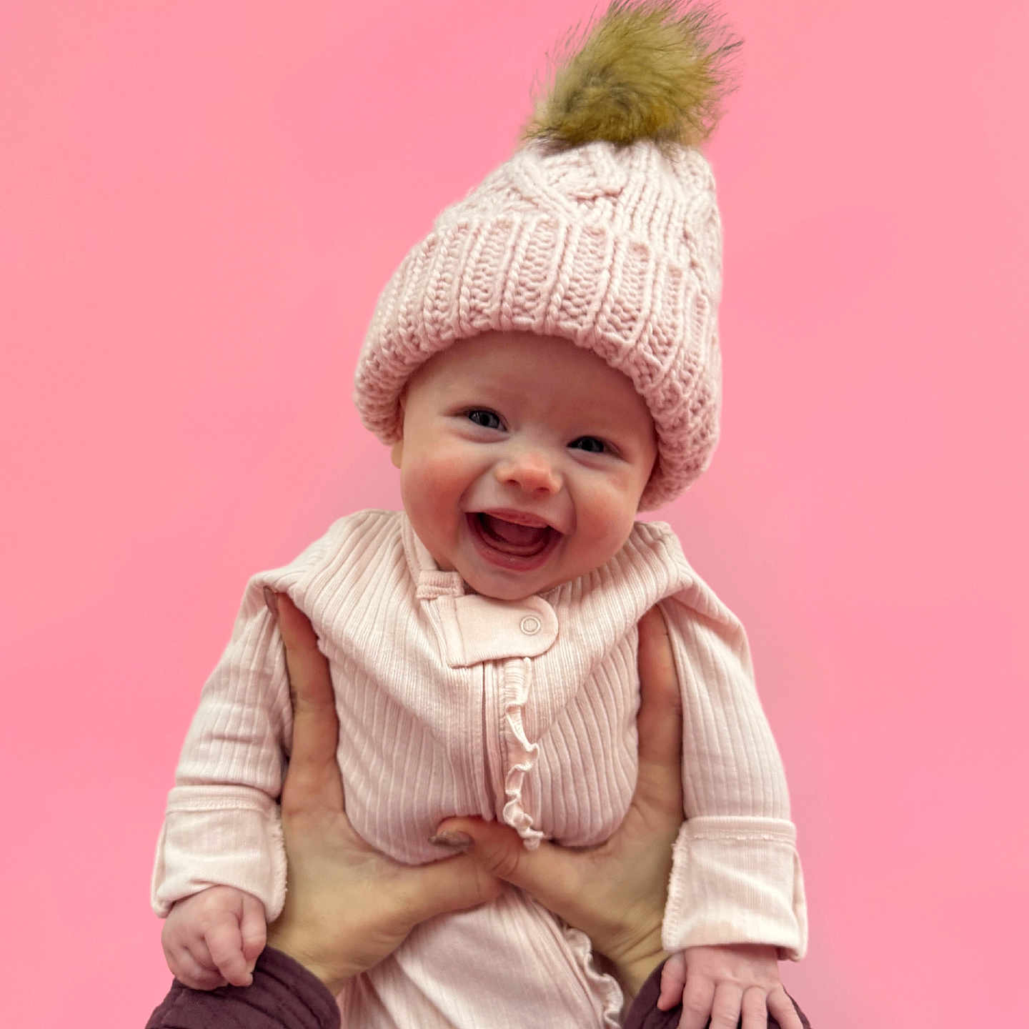 Olivia joined the competition — help win amazing prizes! baby, babylaughing, beanie, bodypart, bonnet, cap, clothing, face, finger, hand, happy, hat, head, hood, laughing, newborn, person, photography, portrait, smile