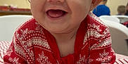 Thomas is registered to the contest to win money with this photo: baby, child, closeup, clothing, crawling, cute, face, hands, happy, indoor, infant, joyful, person, portrait, red, smiling, striped, sweater, tablecloth, white