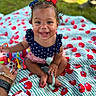 Hannah is registered to the contest to win money with this photo: toddler, child, smiling, outdoor, grass, blanket, toy, bows, hair, cute, happy, sitting, playtime, baby, red, blue, pattern, summer, person, portrait