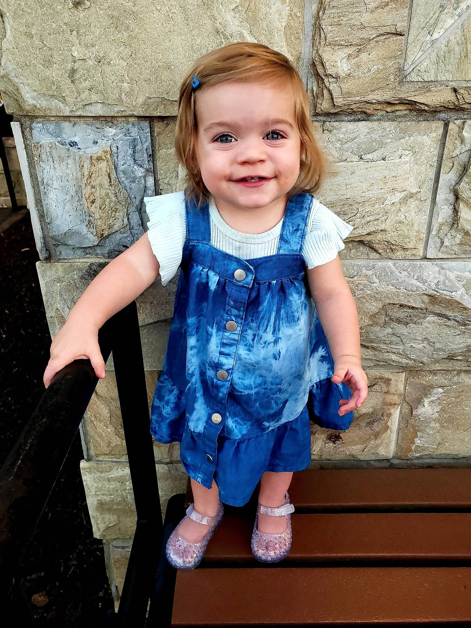 Penny is registered to the contest to win money with this photo: baby_toddler_clothing, child, day_dress, denim, electric_blue, flash_photography, fun, happy, joy, leisure, pattern, people_in_nature, person, purple, sandal, sitting, smile, spring, standing, toddler