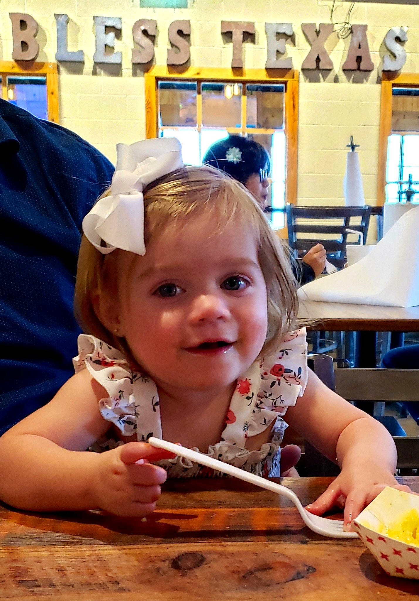 Penny joined the competition — help win amazing prizes! baby_toddler_clothing, chair, child, comfort_food, eating, food, fun, happy, joy, leisure, person, room, sitting, smile, table, tableware, toddler, vacation, wood, yellow