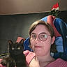Rengar participe au concours pour gagner de l'argent avec cette photo : person, cat, black_cat, glasses, pink_sweater, indoor, selfie, kitten, animal, pet, christmas_tree, santa_hat, blanket, furniture, face, portrait, cute, cozy, home, holiday