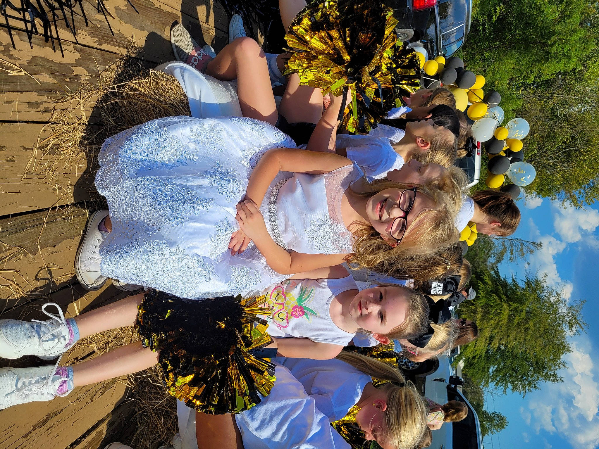 Sarah joined the competition — help win amazing prizes! blue, child, event, flower, fun, grass, happy, human_leg, joy, leisure, people_in_nature, person, plant, pole, recreation, sky, spring, summer, tradition, tree