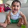 Sandro joined the competition — help win amazing prizes! baby, smiling, indoor, couch, toy, green, white_shirt, shorts, child, happy, cute, face, person, skin, hands, feet, furniture, blanket, plush_toy, home