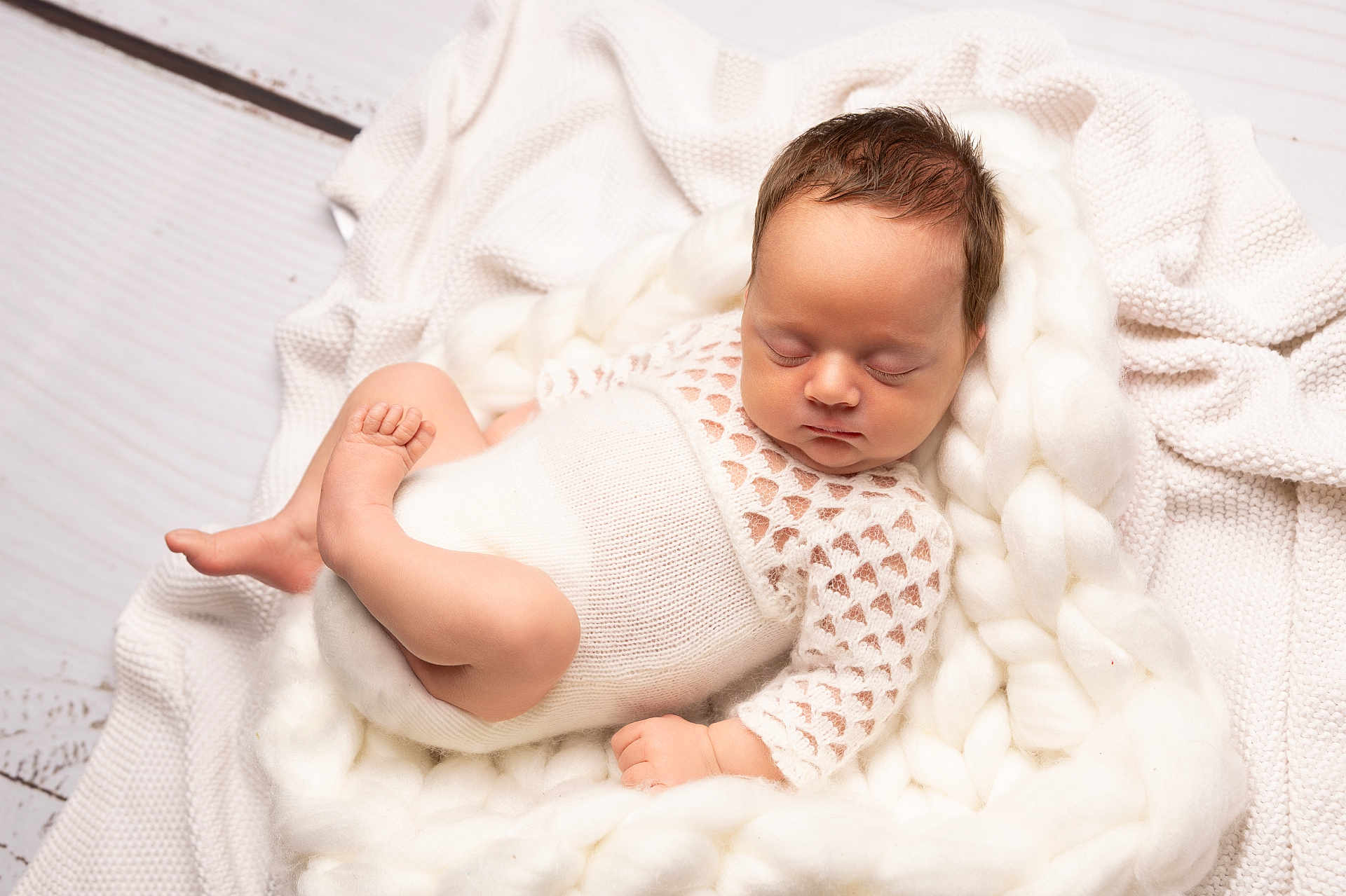 Paisley is registered to the contest to win money with this photo: newborn, baby, sleeping, knitted_outfit, white, blanket, cozy, soft, infant, cute, peaceful, wrapped, cuddly, portrait, child, indoors, resting, warm, tender, gentle